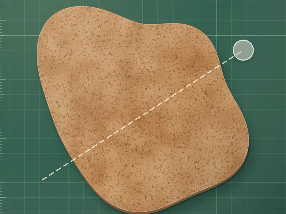A shape on a cutting board, waiting for one straight cut
